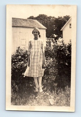 Old Vintage Photo SOLO TEEN GIRL STANDING IN YARD BY GARAGE BARN SNAPSHOT PIC