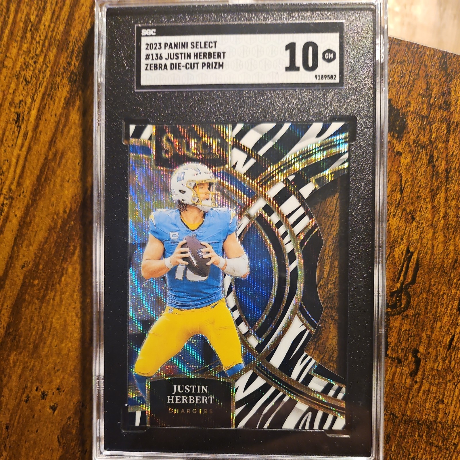 2023 Panini Select - Premier Level Zebra Prizm Die-Cut #136 Justin Herbert