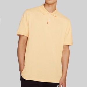 yellow nike polo
