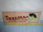 1974 VINTAGE 19x7 in THELMA THE QUEEN OF PERFUME ADV SIGN TIN METAL TACKER -X101