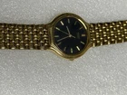 Seiko Gold-Tone Vintage Watch With Black Face & Stainless Steel Back