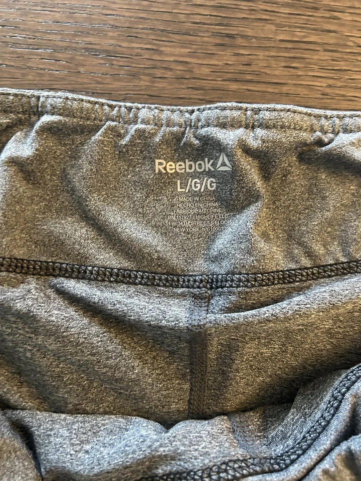 Pantalones cortos de running Reebok Intensity 2-1 para mujer talla grande negros grises Foto 2 de 4