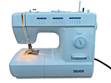 Working Silver Model 1002 Sewing Machine barely used in very good condition