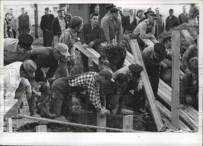 1959 Press Photo Rescuers Dig for Two Men Buried Alive and Succeeded - mja74161