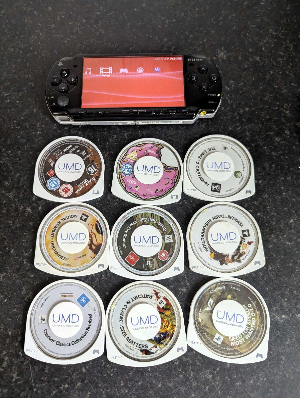 Sony PSP 2000 Handheld Console + Games + movies + charge cable