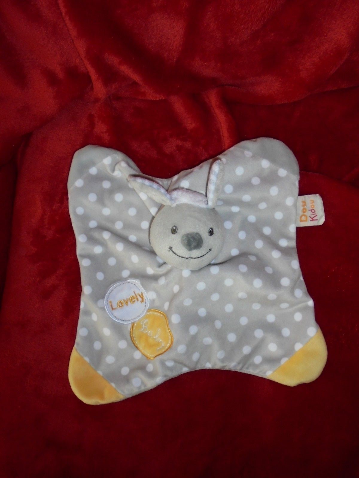 Doudou plat gris mouton Doukidou à pois blancs et coins jaunes pour bébé