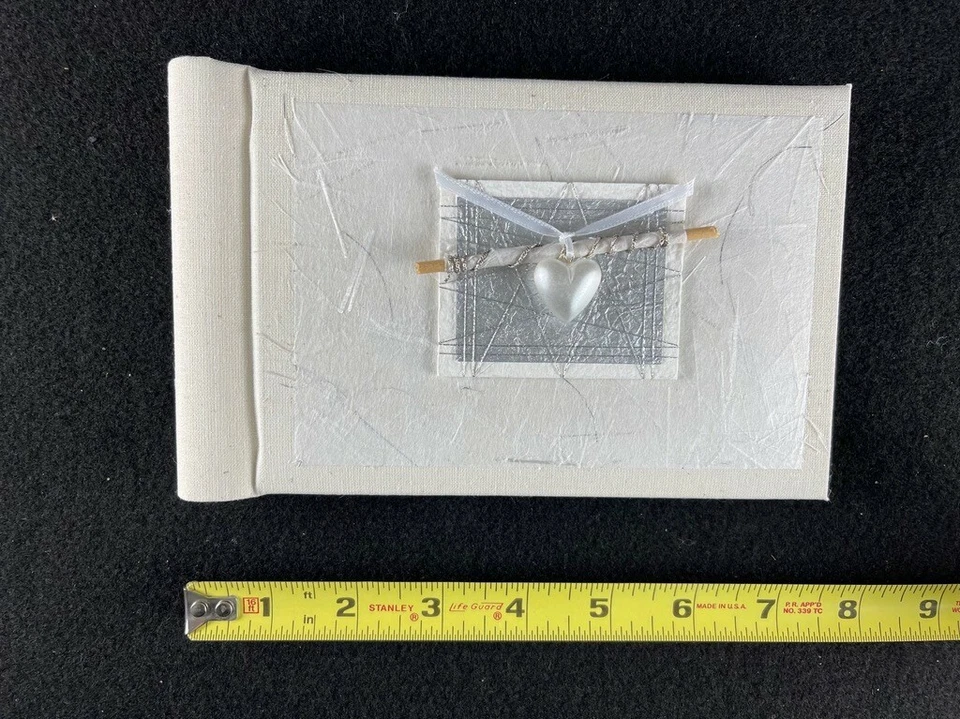 Álbum de fotos nupciales hecho a mano por Nina Matsuno Studio. Hermoso recuerdo Foto 2 de 4