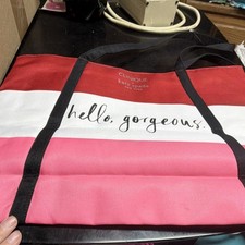clinique x kate spade new york red white pink striped tote bag with printed text