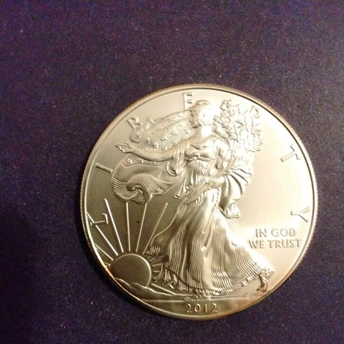 2012 AMERICAN SILVER EAGLE BU .999 PURE SILVER In enclosed capsule!