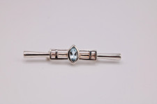 A silver Rennie Mackintosh style brooch
