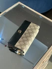Portefeuille long Gucci GG Supreme Zippy autour beige excellent état authentique
