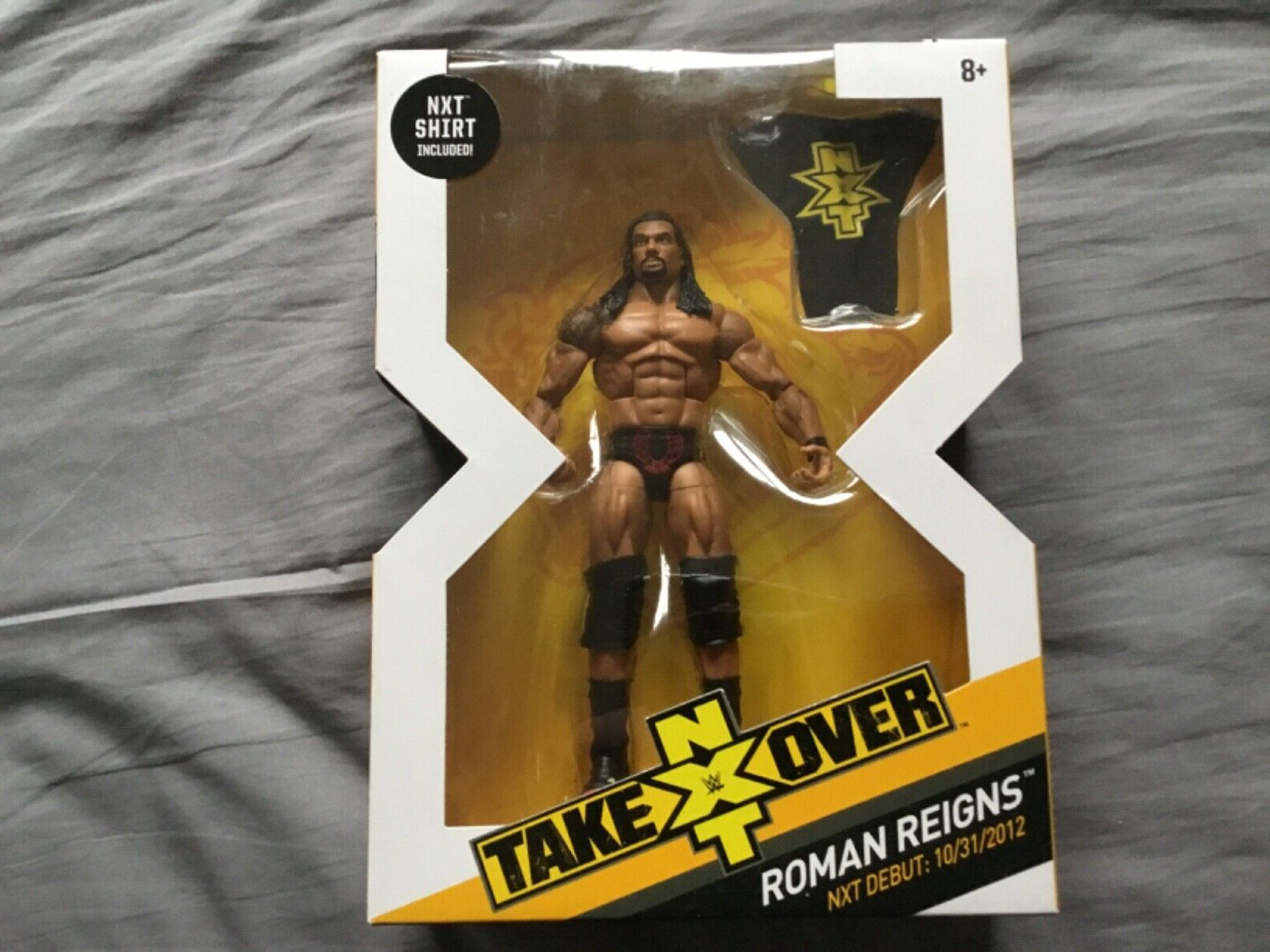 WWE Wrestling Elite NXT Takeover Roman Reigns Action Figure new in box.