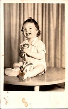 RPPC Adorable Baby Holding Ball and Toy 