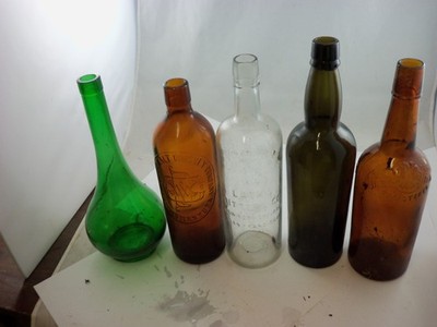 lot of 5 embossed and colored whiskey bottles