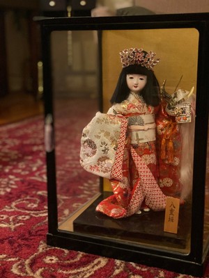 vintage geisha doll in glass case