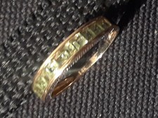 14k size 7 gold ring with 12 princess green peridot .506 ctw.