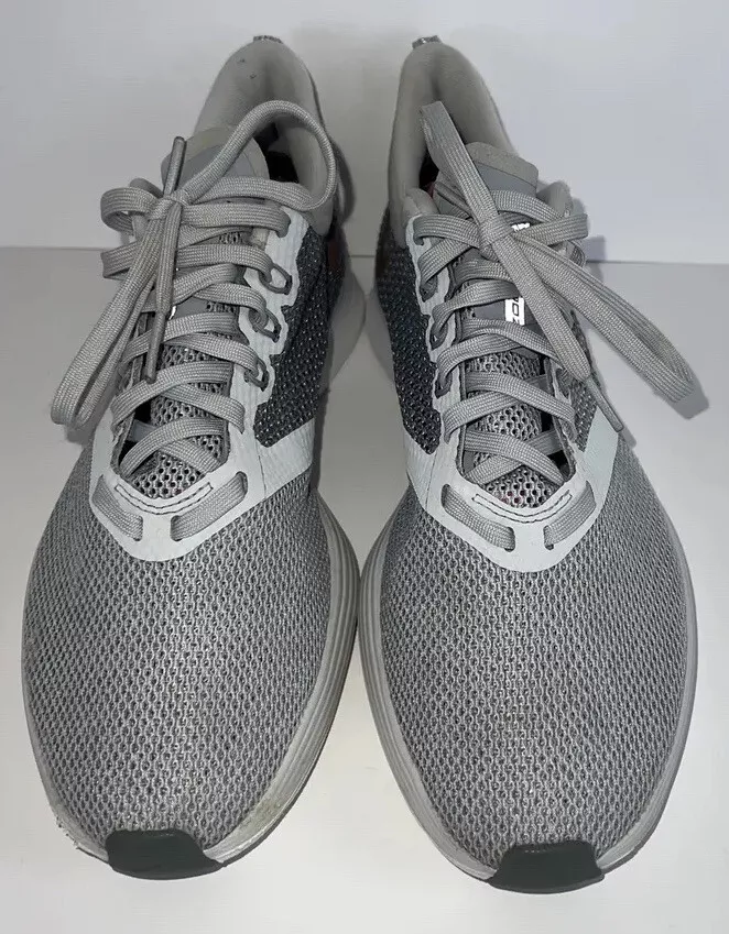 Nike running air zoom strike trainers in best sale grey