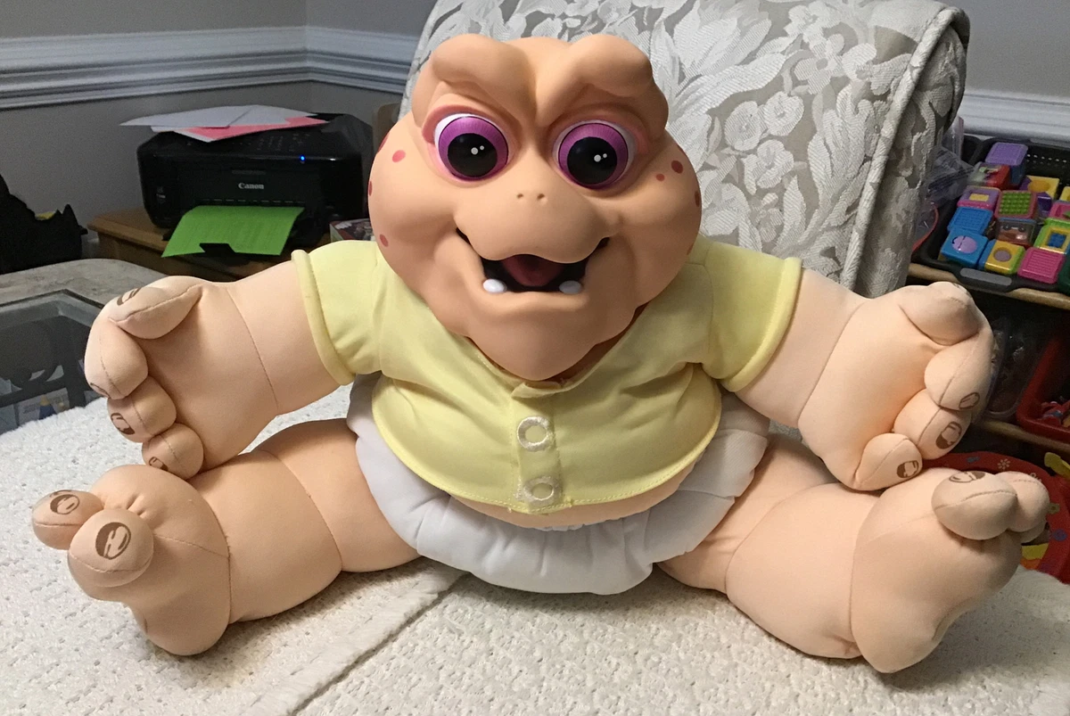 Baby sinclair sales stuffed animal