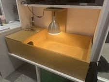 Wooden tortoise table with sleep area and basking lamp. Full set up.