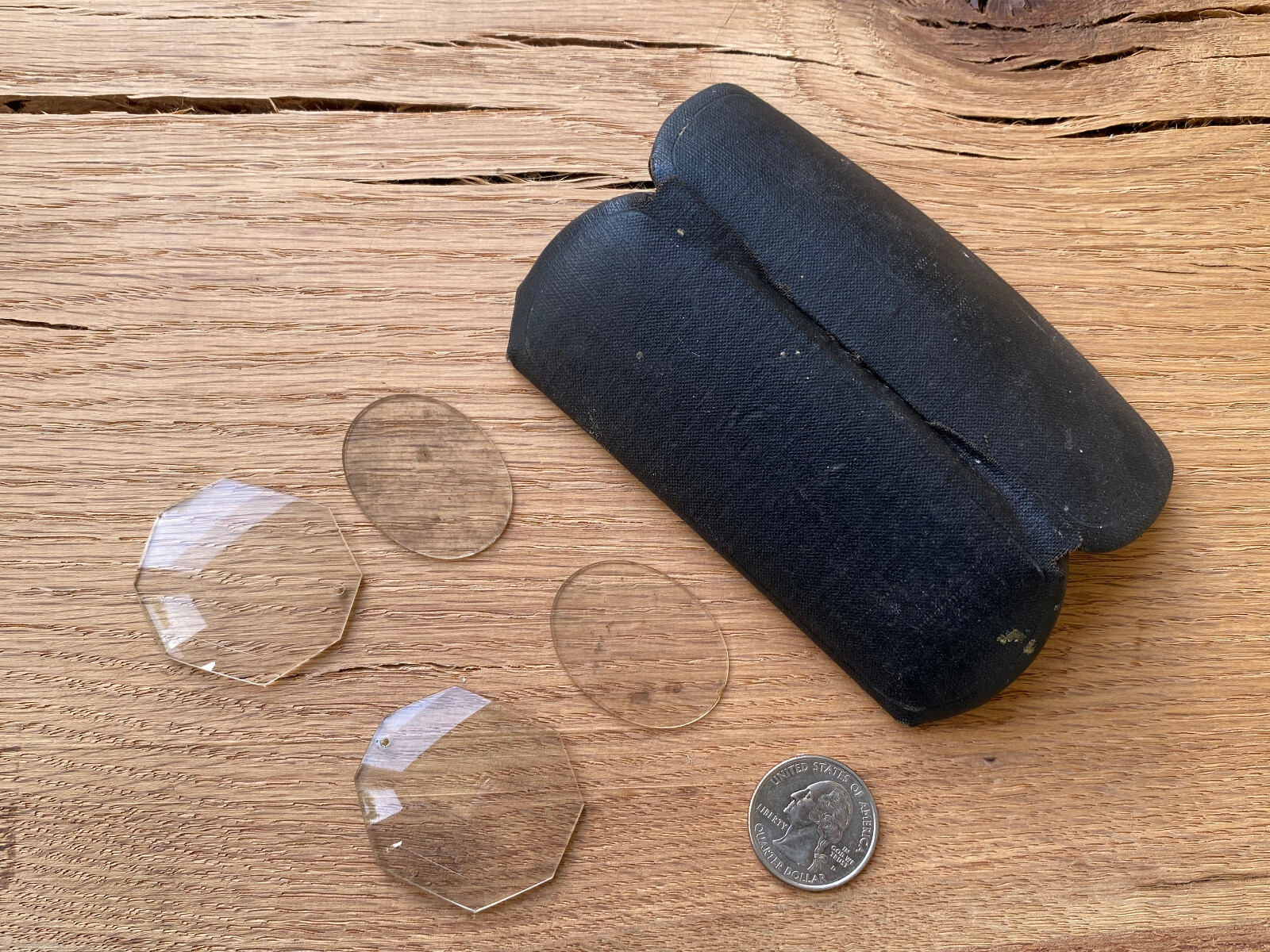 Antique glasses two sets of loose lenses and small black eyeglass case