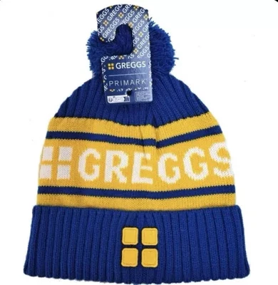 PRIMARK GREGGS BLUE YELLOW BOBBLE HAT KNITTED ONE SIZE UNISEX BRAND NEW LIMITED EDITION