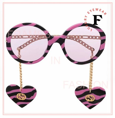 GUCCI SUNGLASSES WITH HEART PENDANTS