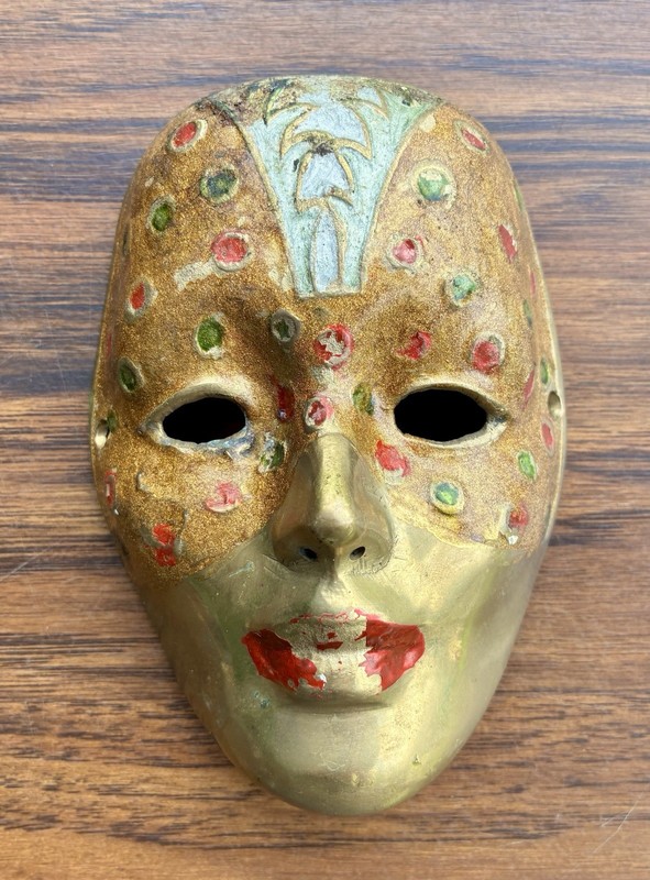 VINTAGE BRASS INDIAN WALL MASK FEATURING A HAND PAINTED CARNIVAL STYLE DESIGN