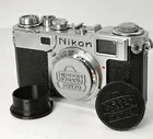 Custom Petrakla Nikon Nippon Kogaku body cap, one grey or black.