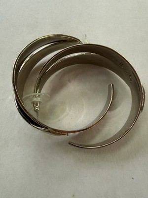 Elegant Stella& Dot silver-tone hoop earrings for women. Features a modern look.