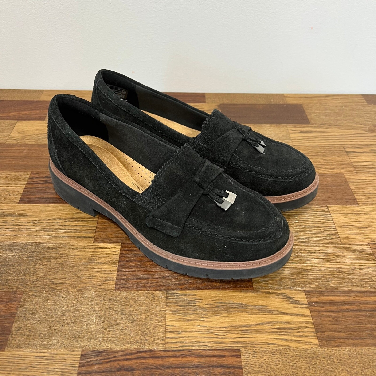 Clarks Womens Westlynn Bella Slip On Loafer in Black Suede Leather with Tassel Detail