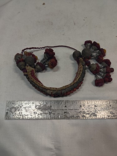 19th c Anklet Rajasthan Circa 1880 fabric tassels, burgundy , a woven band.