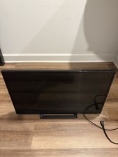 "Vizio flat-screen TV in excellent condition. Includes a power cord.
