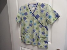 Ladies scrub top by SB Scrubs, size small, light green with flowers.