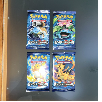 Pokémon Evolutions Booster Pack 4x Englisch Blastoise Venusaur Charizard Raichu