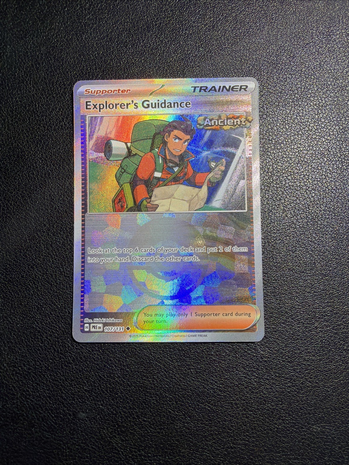 Explorer's Guidance 107/131 Poke Ball Holo Prismatic Evolutions NM