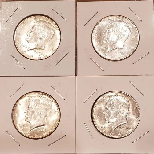 Four 1964 Kennedy half dollars