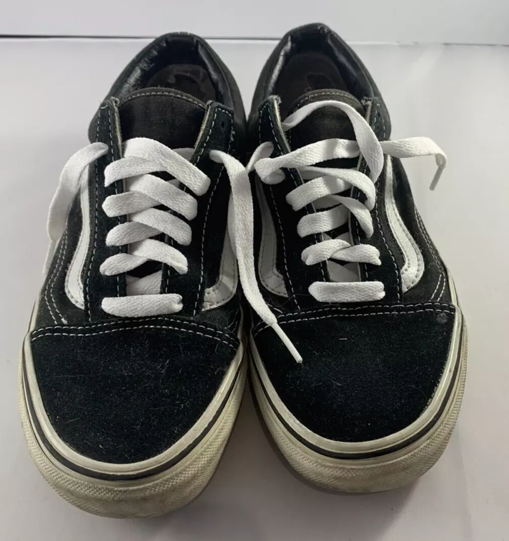 Black vans with white stripes top