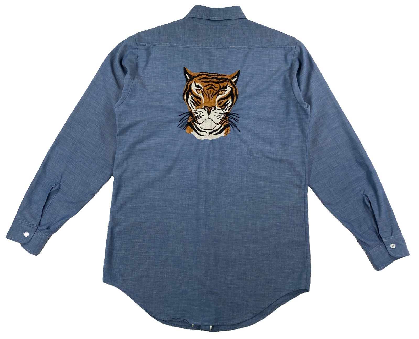 Blue chambray work shirt with an embroidered tiger graphic on the chest