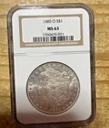 1885-O $1 Morgan Silver Dollar NGC (New Orleans mint). MS63