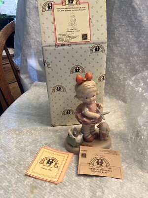 Enesco. figurine. Memories of Yesterday. Opening presents is much fun. Girl wit