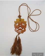 Chinese jade amulet with double sided carved Double Dragon talisman on cord