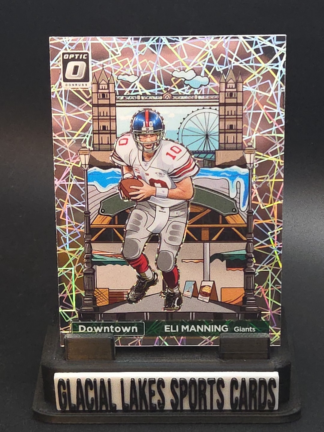 2023 Donruss Optic, International Downtown, Eli Manning, Case Hit, #1