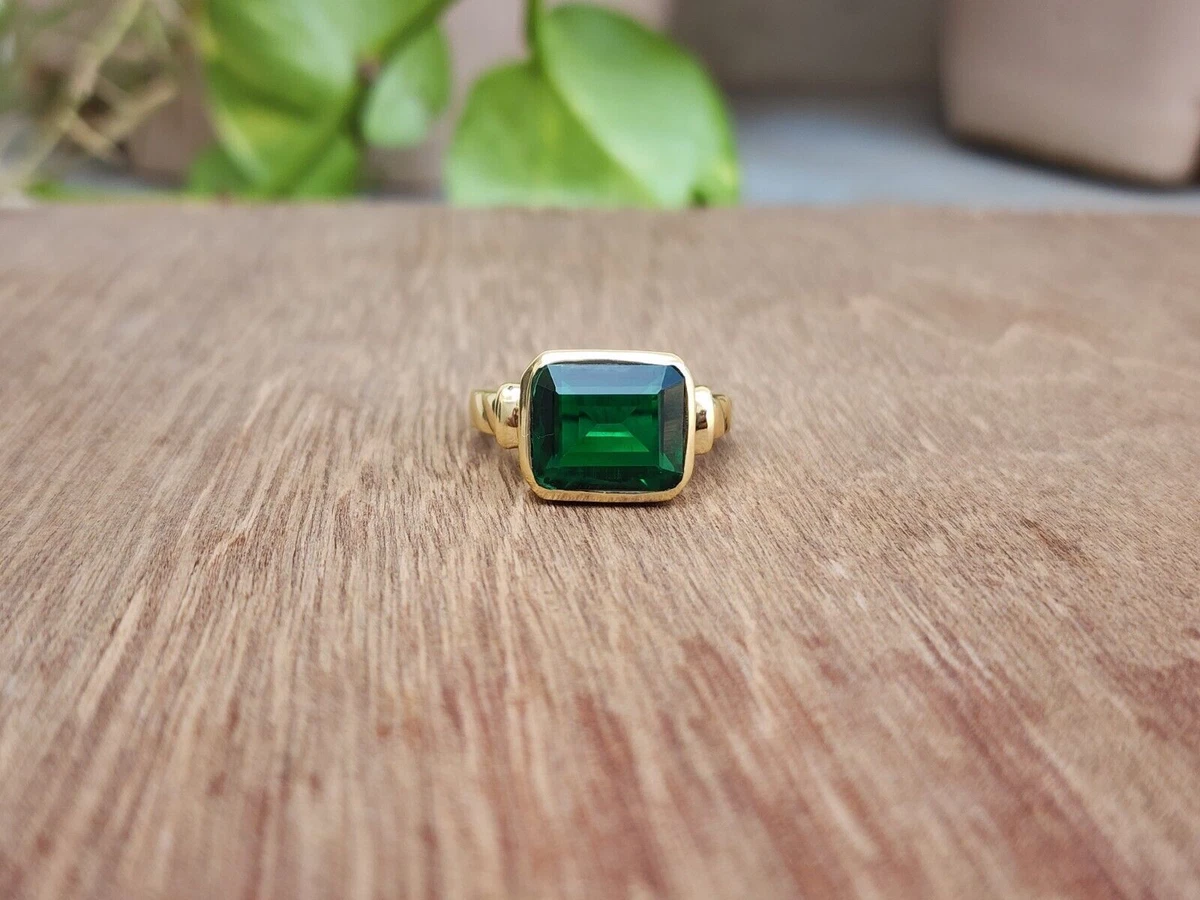 Gold ring with green stone deals