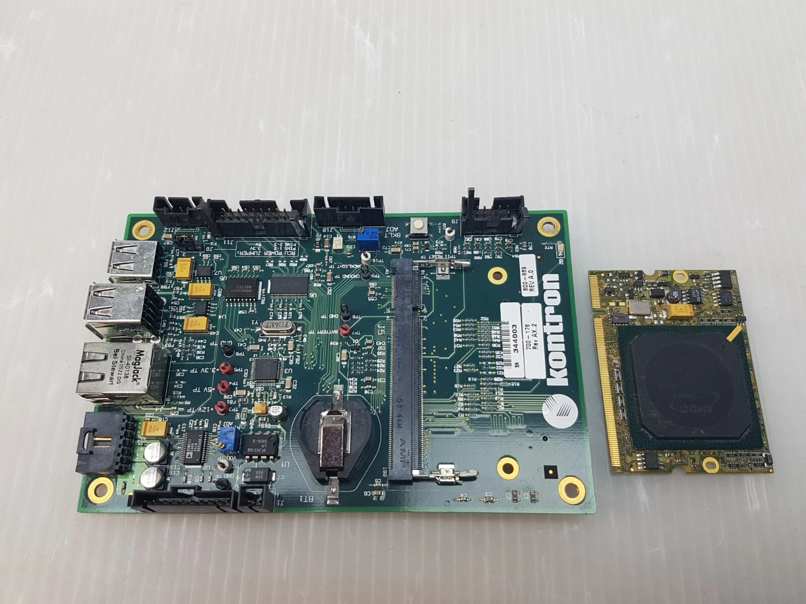 Kontron board next to its AMD Geode processor module removed from the socket