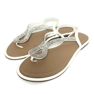 white strappy flip flops