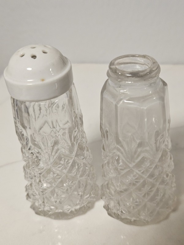 A Group Of 4 Salt And Pepper Shakers