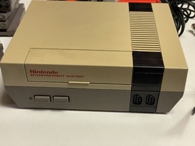Nintendo NES console bundle with controllers, zapper, and games Tested