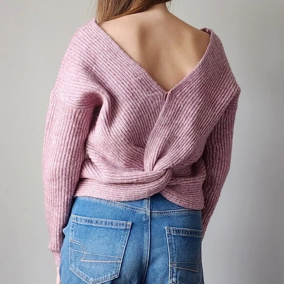Sweater with top knot in back
