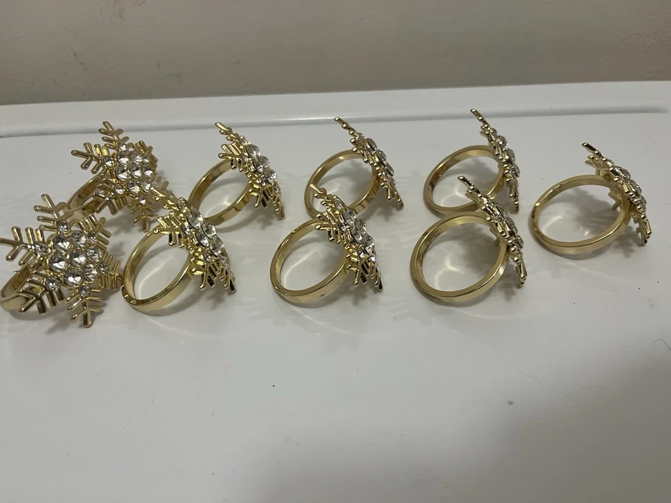 Juego de 8 y 1 extra servilleteros copo de nieve chapados en oro y diamantes de imitación Foto 2 de 4