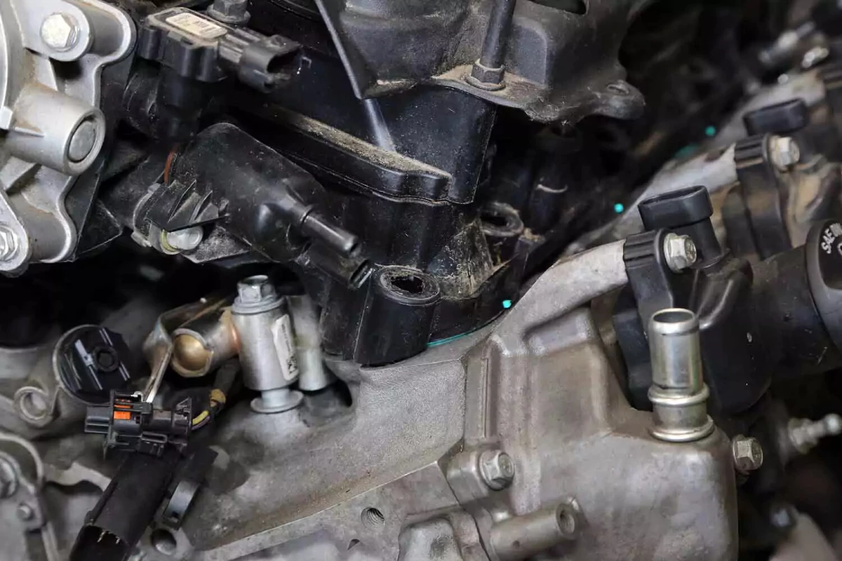 A close-up view of a plastic intake manifold on a domestic V-8 engine.